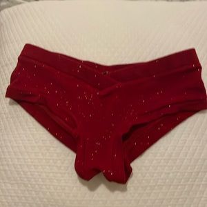 Sz 4: Lunalae crimson red sparkle pole shorts.